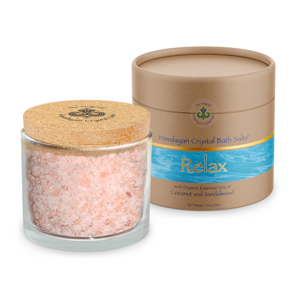 Relax Bath Salts product glass jar filled with Himalayan Crystal Salt, cork cover and tan product box with bands of gold and ocean blue water both featuring Himalayan Crystal Salt logo, on white background