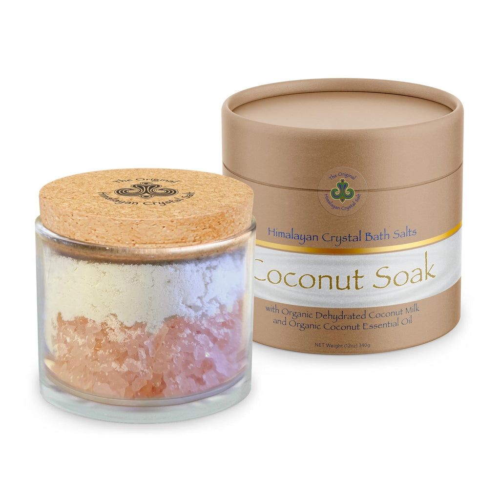 Coconut Soak product glass jar with cork top and tan product box with gold and white bands featuring Himalayan Crystal Salt logo, and filled with coconut milk and Himalayan Crystal Salt on white background