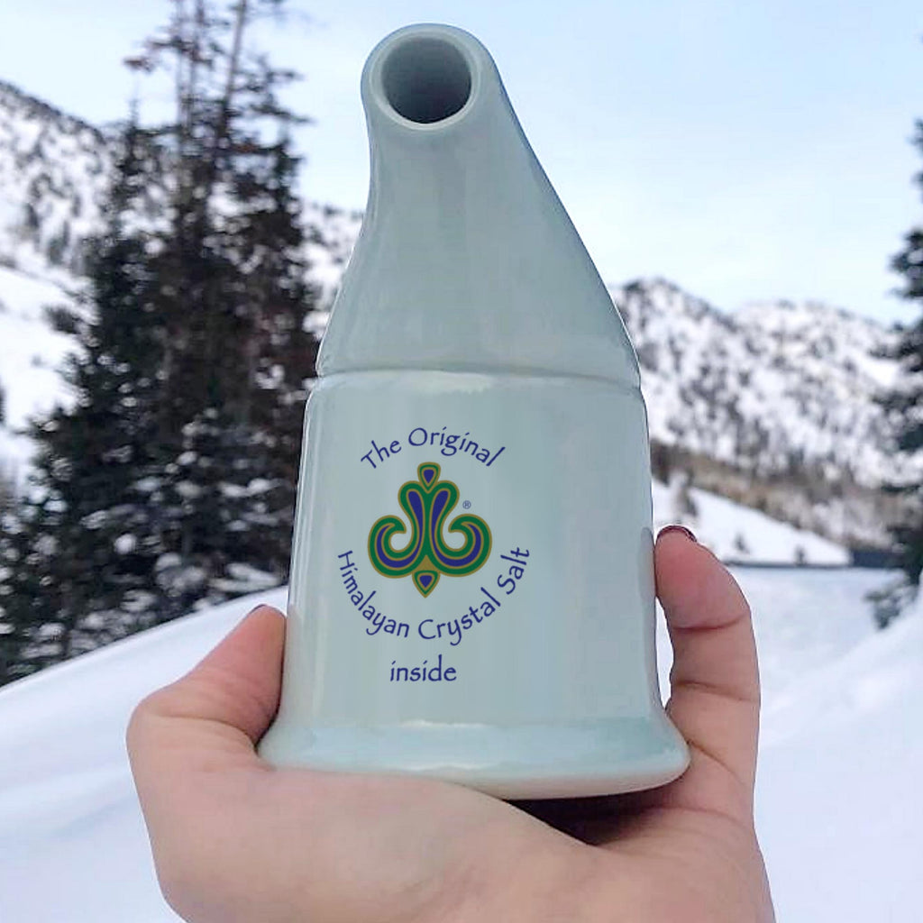 Coarse Salt Refill for Inhaler off-white ceramic inhaler in white hand, with snow, trees and mountains in background