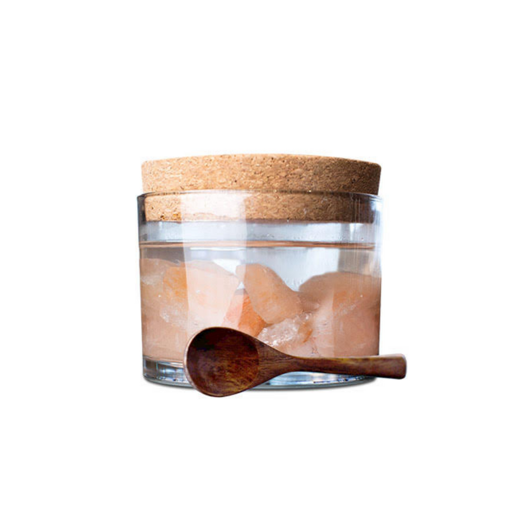 Sole Himalayan Crystal Salt jar with Himalayan Crystal Salt stones and water, with cork cover, fand leaning wooden spoon